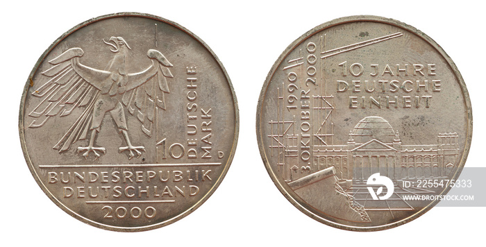 Germany - circa 2000: a 10 Deutsche Mark coin of the Federal Republic of Germany with the cote of arm eagle and the Reichstag building. Text: 10 years of germans reunification .