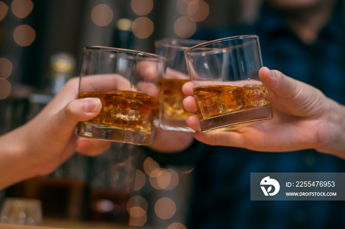 Celebrate whiskey on a friendly party in restaurant.