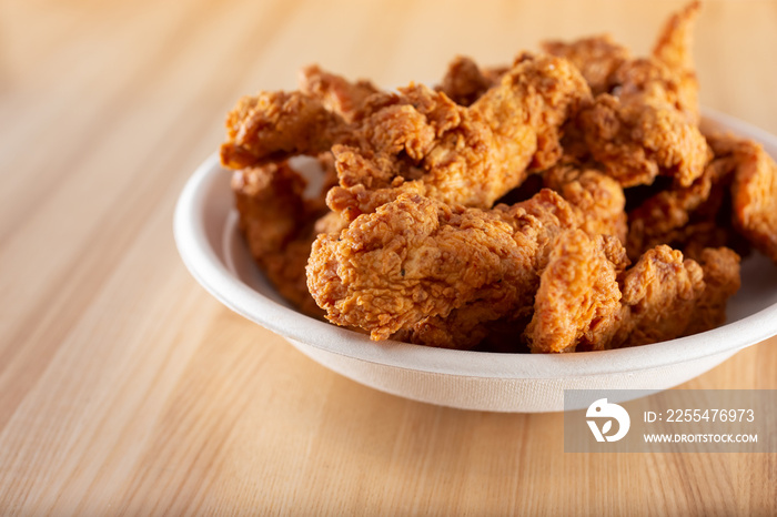 A view of a bowl of chicken tenders.