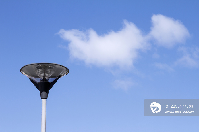 Modern lamp with blue background and cloud