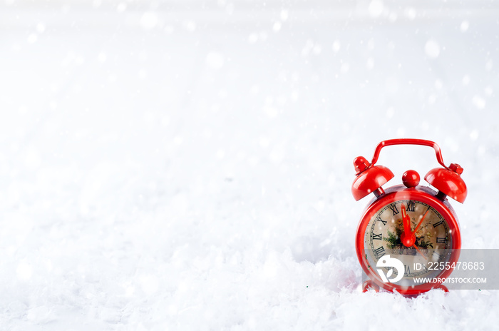 vintage alarm clock in the snow