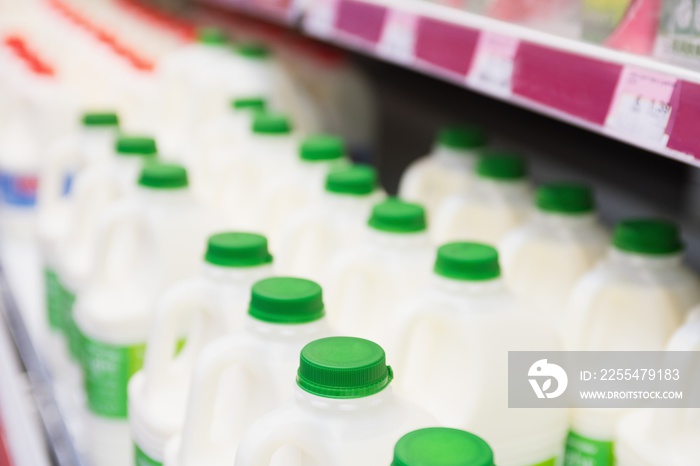 Milk bottles tidied in shelf