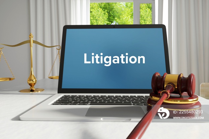 Litigation – Law, Judgment, Web. Laptop in the office with term on the screen. Hammer, Libra, Lawyer.