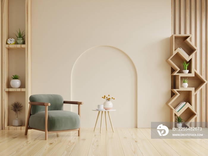 Living room with green armchair on empty cream color background.