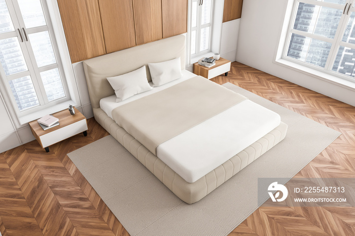 Top view of wooden bedroom interior with bed and panoramic window