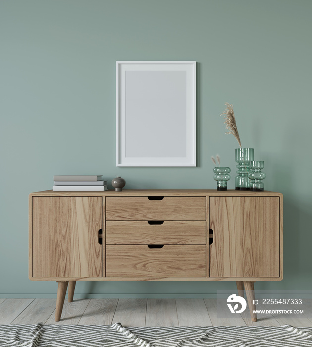 Mock up interior with wooden chest of drawers and poster on g…