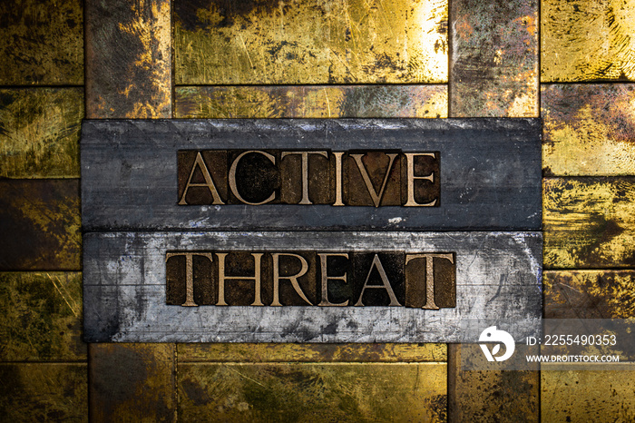 Active Threat text on grunge textured authentic copper and gold background