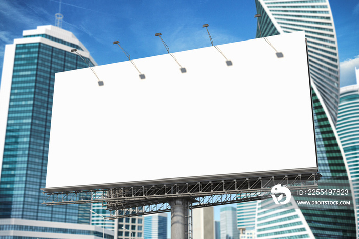 Blank billboard in the street of downtown city skyscrapers.