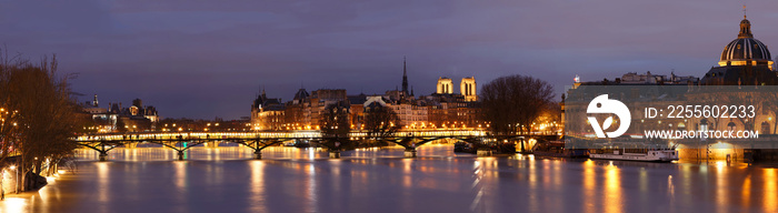 The view of Seine river at night with some touristic bridges like Pont des Arts and Pont Neuf, build