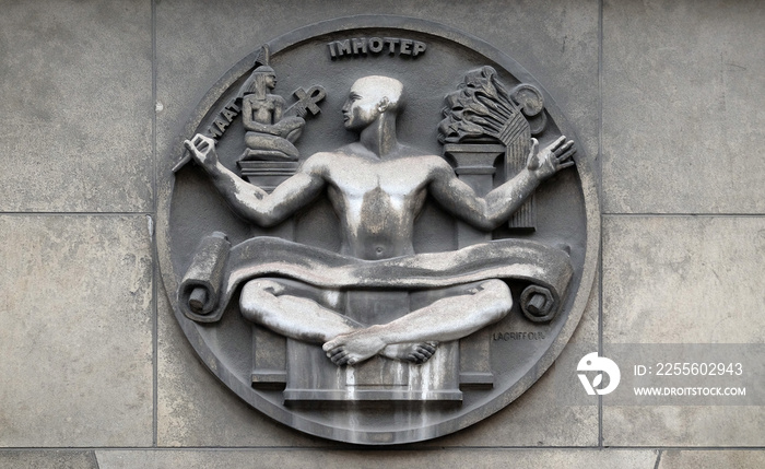 Maat and Imhotep. Stone relief at the building of the Faculte de Medicine Paris, France