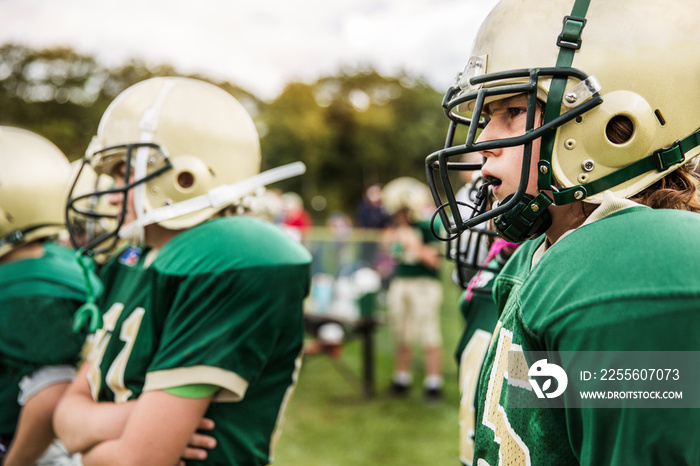 American football players standing in field