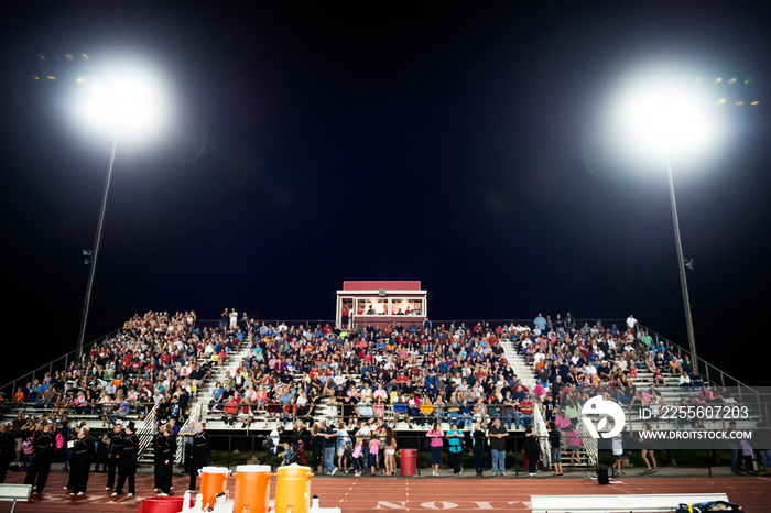 Spectators on stadium at night