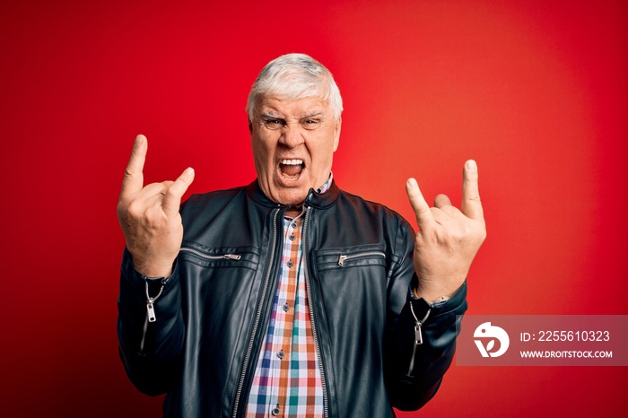 Senior handsome hoary man wearing casual shirt and jacket over isolated red background shouting with