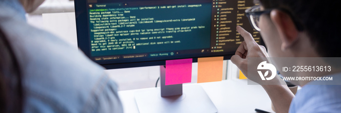 Young startup Programmers Sitting At Desks Working On Computers screen for Developing programming an