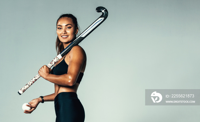 Female hockey player looking at camera