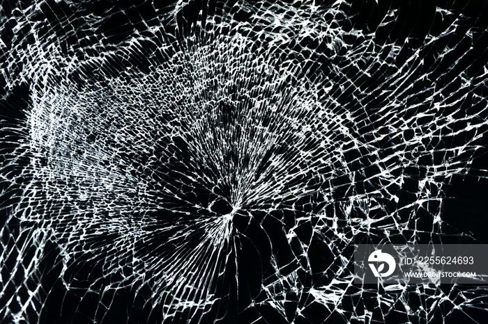 broken smartphone, close-up of broken glass, broken screen on a black background