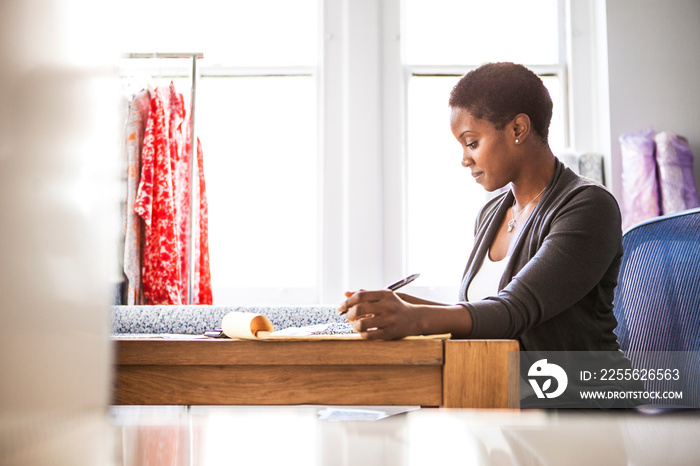 Female tailor working at desk