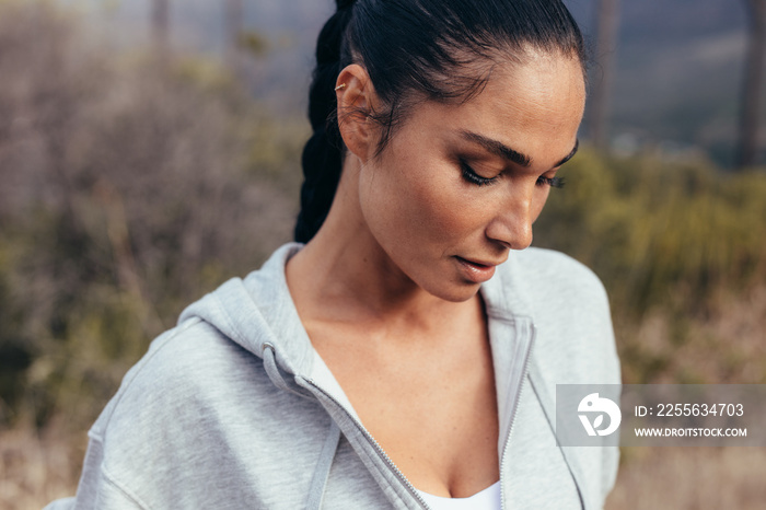 Female taking a break after running workout