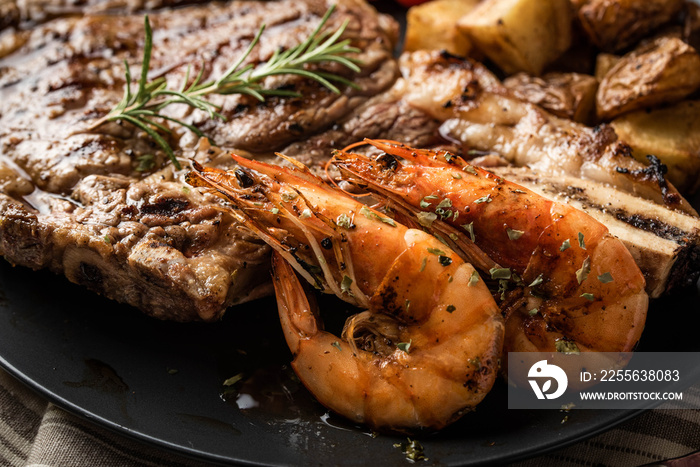 surf and turf, ribeye steak and grilled prawn