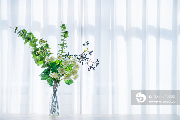 Bouquet in vase decorated near white curtain.  Modern lifestyle concept.