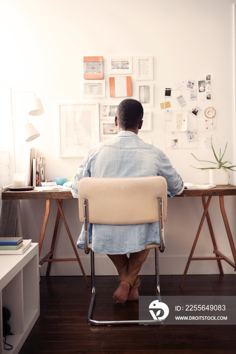 Man sitting in office at home