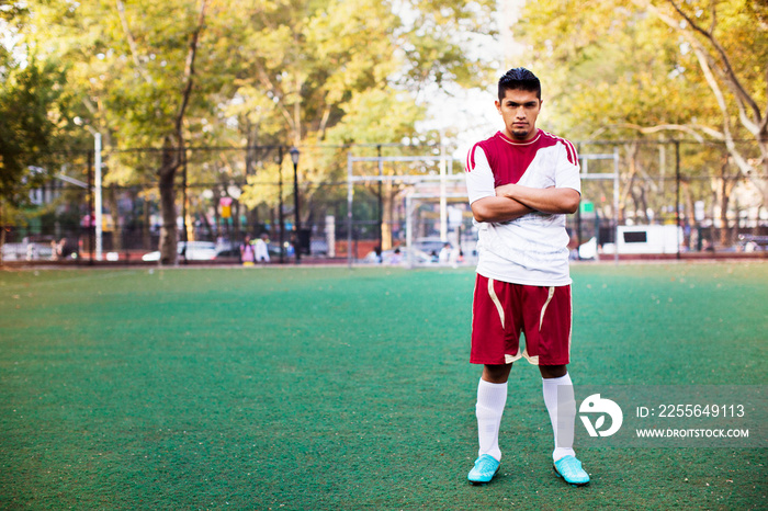 Soccer player standing in soccer field