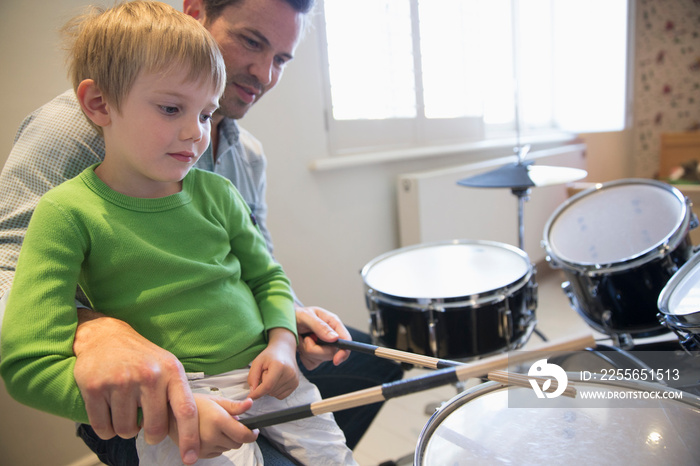 Father and son playing drums