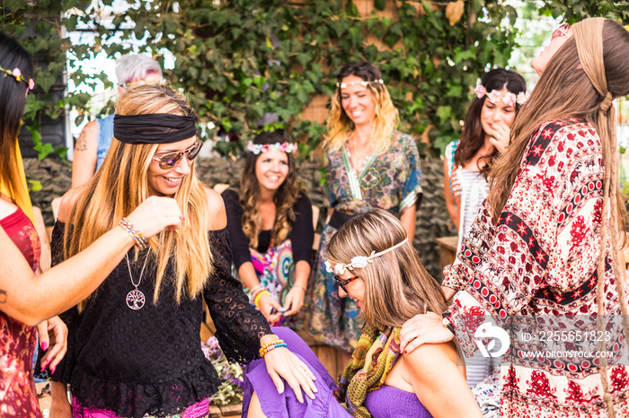 young women and girls in friendship all together celebrating and having fun in a bio natural place. 