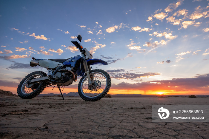 Dual Sport dirt bike on El-mirage dry lake at sunrise