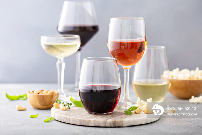 Red, white wine and rose in different glasses