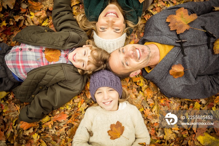 Smiling young family doing a head circles