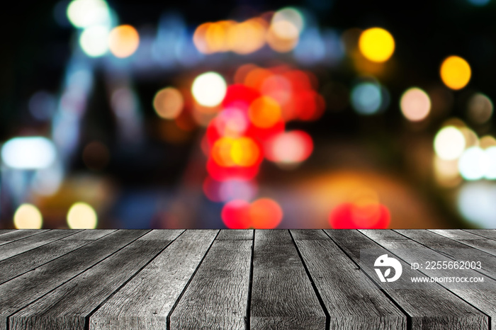 Table top. empty wooden board, table or modern wooden terrace with abstract night light bokeh at nig