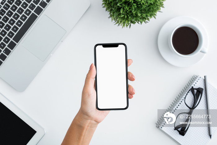 Hand holding smartphone with big blank screen