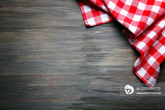 Checkered napkin on wooden background