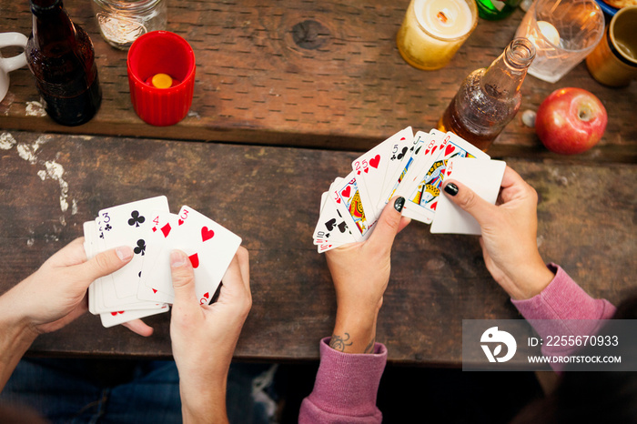 Young people playing cards