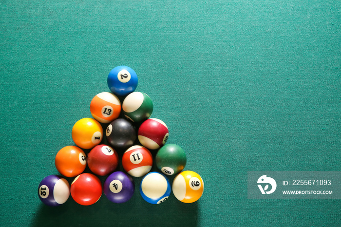 Billiard balls on green table