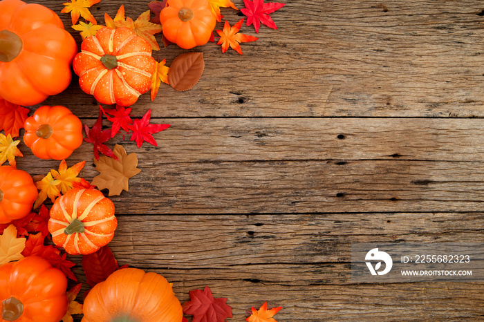 Autumn leaves on wooden background