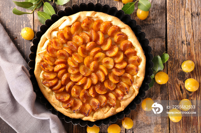 plum tart on wood background