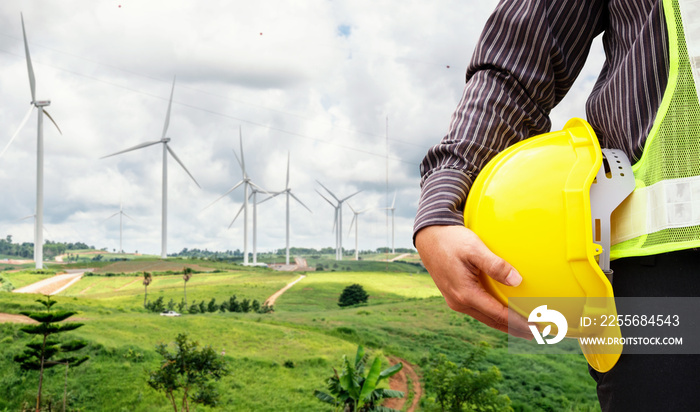 Engineer worker at wind turbine power station construction site