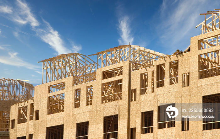 A new apartment complex being framed with wood and plywood lumber