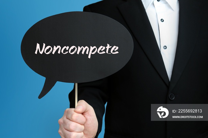 Noncompete. Businessman (Man) is holding the sign of speech bubble in his hand. Handwritten Text on 