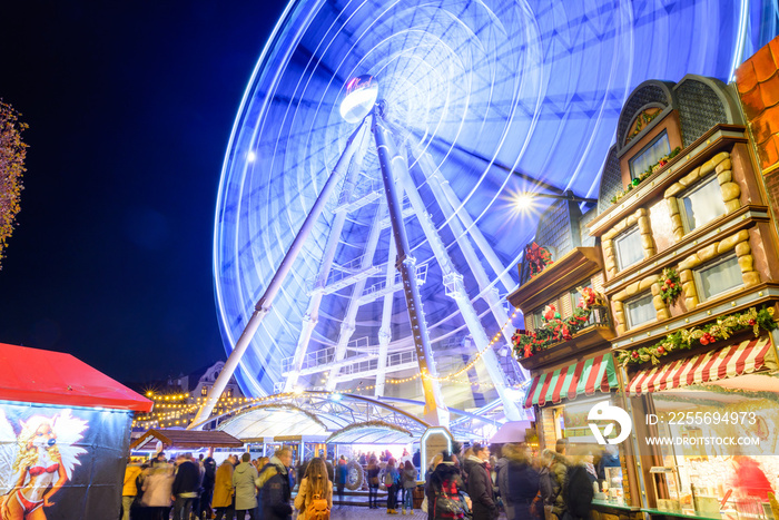 Night colorful atmosphere of Weihnachtsmarkt, Christmas market, in Düsseldorf, the ferris wheel and 