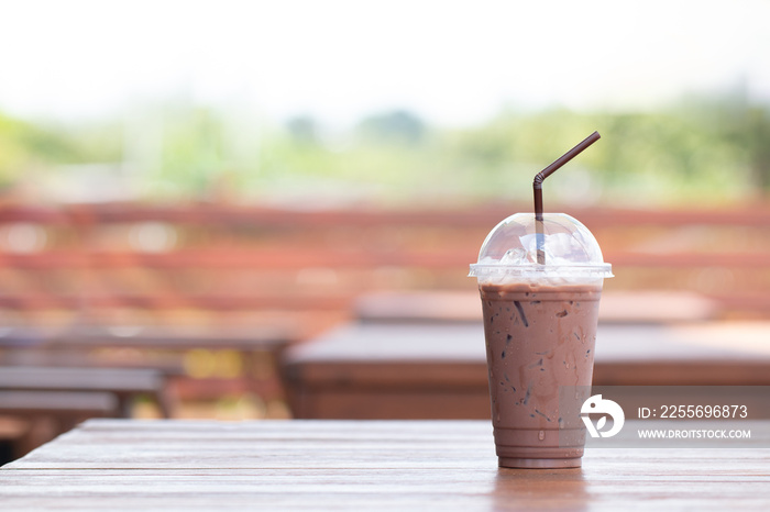 Iced chocolate milkshake, Summer refreshment drinks on wooden background in cafe