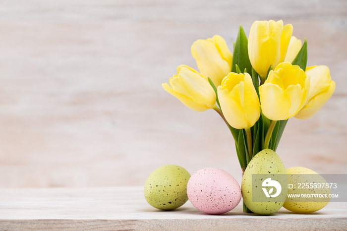 Yellow tulips, spring flowers and Easter decoration.