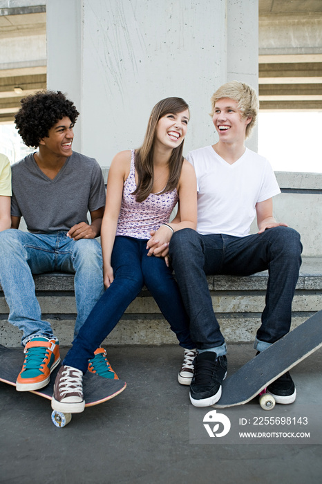 Teenage friends with skateboards