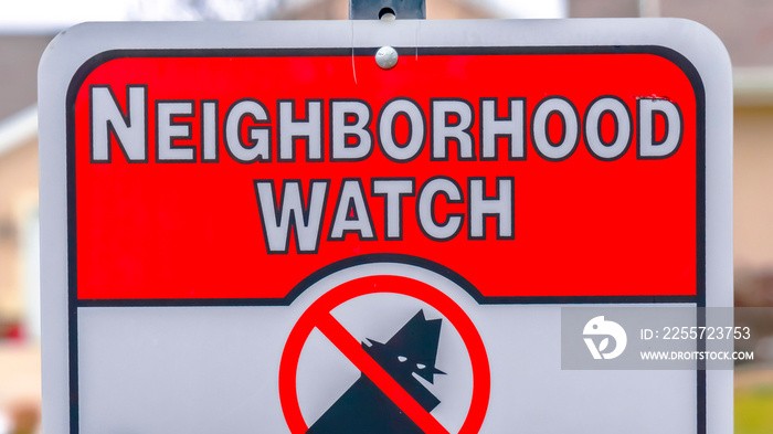 Panorama frame Close up of a Neighborhood Watch sign against a blurred background