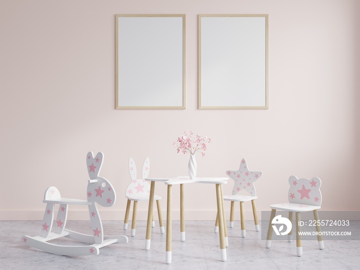 Childrens room with picture frames on the pink wall is decorated with childrens chairs and benches