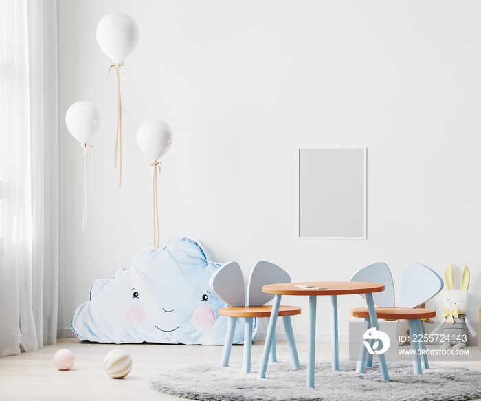 Frame mock up in children room interior in white tones with kids table and chairs, soft toys and bal