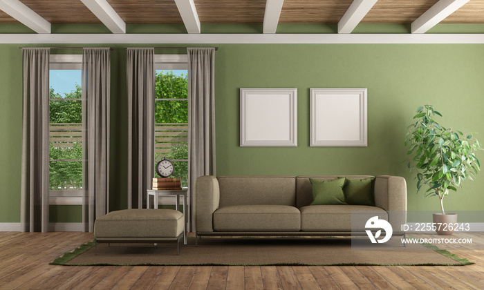 带现代沙发和脚凳的绿色客厅