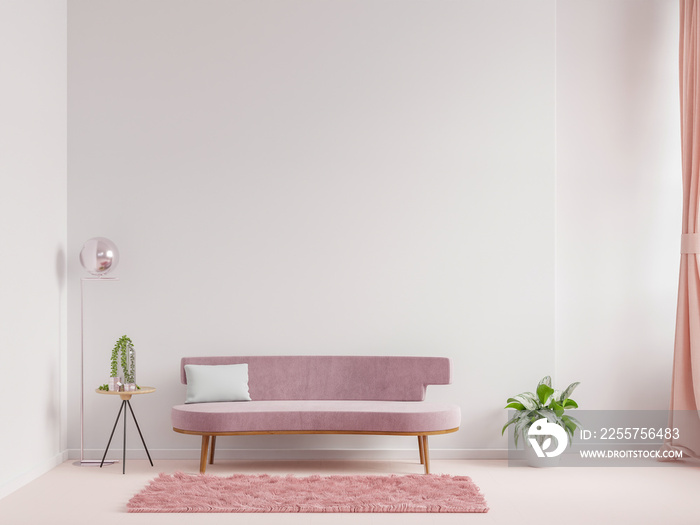 现代客厅的室内设计是一张粉红色的沙发和扶手椅，背景是白色的空墙。